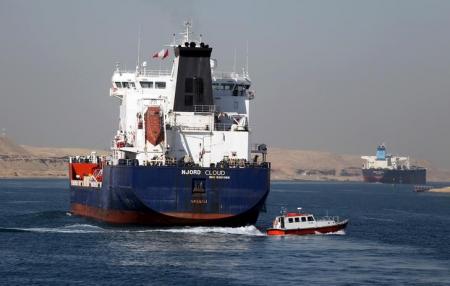 A cargo ship passes through the New Suez Canal, in Ismailia, Egypt, January 17, 2016. REUTERS/Mohamed Abd El Ghany
