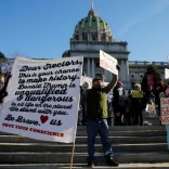 People protest against U.S. President-elect Donald Trump as electors gather to cast their votes for U.S. president at the Pennsylvania State Capitol in Harrisburg, Pennsylvania, U.S. December 19, 2016. REUTERS/Jonathan Ernst
