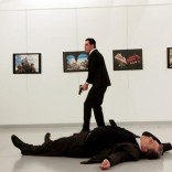 Russian Ambassador to Turkey Andrei Karlov lies on the ground after he was shot by Mevlut Mert Altintas at an art gallery in Ankara, Turkey. Hasim Kilic/Hurriyet via REUTERS