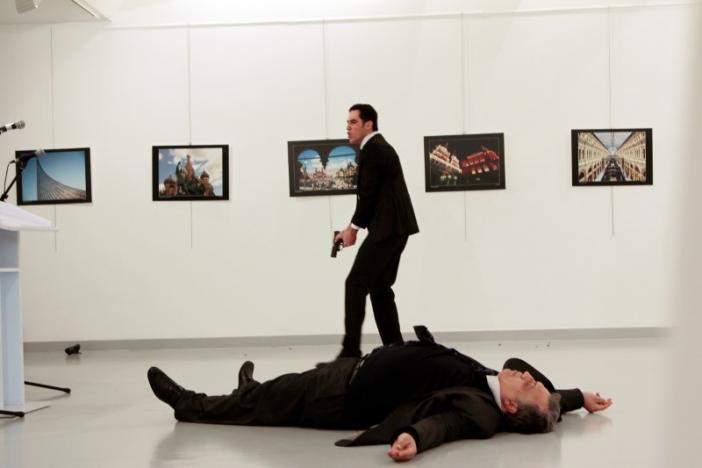 Russian Ambassador to Turkey Andrei Karlov lies on the ground after he was shot by Mevlut Mert Altintas at an art gallery in Ankara, Turkey. Hasim Kilic/Hurriyet via REUTERS