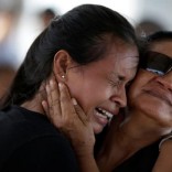 A woman is seen crying after receiving the information that her brother was one of the inmates who died during a prison riot, in front of the Medical Legal Institute in Manaus, Brazil, January 3, 2017. REUTERS/Ueslei Marcelino