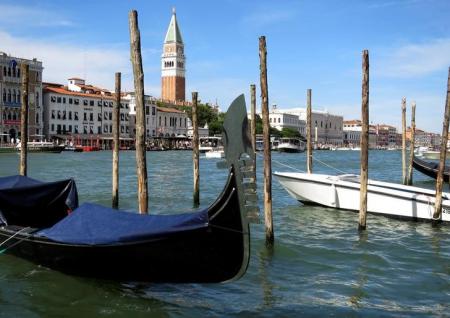 A gondola is pictured in the Grand Canal (Canale Grande) in Venice lagoon with the Campanile belltower in Venice, Italy, June 18, 2016.   REUTERS/Fabrizio Bensch