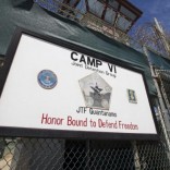 A guard opens the gate at the entrance to Camp VI, a prison used to house detainees at the U.S. Naval Base at Guantanamo Bay, Cuba, March 5, 2013.  REUTERS/Bob Strong