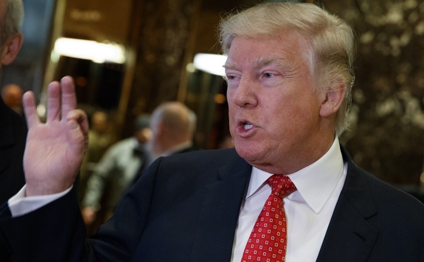FILE - In this Jan. 9, 2017 file photo, President-elect Donald Trump talks with reporters at Trump Tower in New York. As a businessman, Trump has kept the courts busy. That is not likely to end when he enters the Oval Office, creating an unusual and potentially looming problem for a sitting president.  (AP Photo/Evan Vucci, File)
