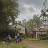 Schoolchildren play in front of an abandoned shaft at Kolar Gold Fields, located in the southern Indian state of Karnataka September 9, 2011. REUTERS/Swetha Gopinath