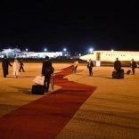 Employees arrange the red carpet prior the departure of the planes of the French delegation at the airport in Abuja, Nigeria May 14, 2016.    REUTERS/Stephane De Sakutin/Pool