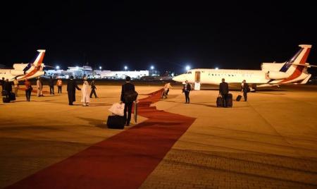 Employees arrange the red carpet prior the departure of the planes of the French delegation at the airport in Abuja, Nigeria May 14, 2016.    REUTERS/Stephane De Sakutin/Pool