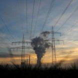 Genreal view of electricity pylons and power lines leading from a power plant.   REUTERS/Kai Pfaffenbach