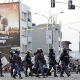 Riot police block a street as police and military forces disperse a procession by Uganda's leading opposition party Forum for Democratic Change supporters with their presidential candidate to a campaign ground, in Kampala, Uganda, February 15, 2016. REUTERS/James Akena