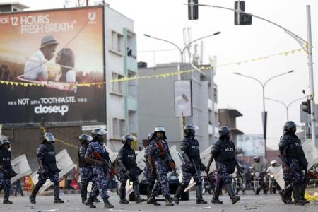 Riot police block a street as police and military forces disperse a procession by Uganda's leading opposition party Forum for Democratic Change supporters with their presidential candidate to a campaign ground, in Kampala, Uganda, February 15, 2016. REUTERS/James Akena
