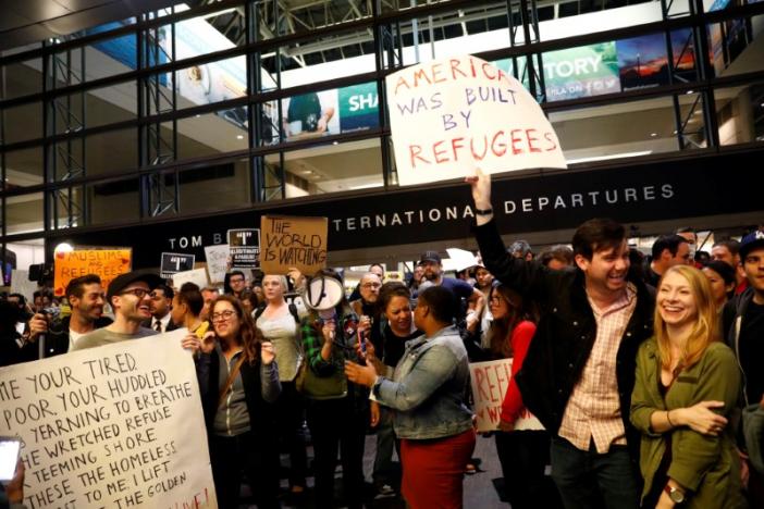 People protest against U.S. President Donald Trump's travel ban on Muslim majority countries at the International terminal at Los Angeles International Airport (LAX) in Los Angeles, California, U.S., January 28, 2017.  REUTERS/Patrick T. Fallon