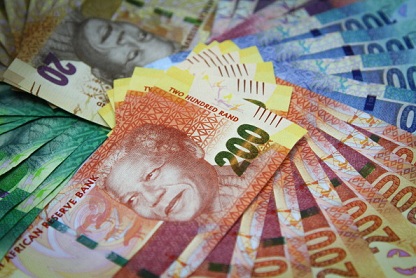 Mixed denomination rand currency banknotes are arranged for a photograph at a First National Bank (FNB) branch in Johannesburg, South Africa, on Friday, March 15, 2013. A recovery in mining and manufacturing is giving South Africa's rand and bonds a breather amid concern that growth is slowing while inflation accelerates. Photographer: Nadine Hutton/Bloomberg via Getty Images