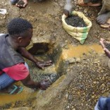 An artisanal miner washes tin ore before it is bagged up and weighed, ready to be transported to the nearest major town for export in the Kalimbi tin mine near the small town of Nyabibwe ,  file.  REUTERS/Jonny Hogg