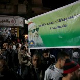 Relatives, studients and friends of Omar Abdel-Rahman, the Muslim cleric known as "The Blind Sheik" who was convicted of conspiracy in the 1993 World Trade Center bombing in New York, shout solgans and hold a banner with his picture reading "A martyr to God" after the funeral outside the Grand Mosque at El Gamalia village in Mansoura city northo of in Cairo, Egypt February 22, 2017. REUTERS/Amr Abdallah Dalsh