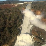 A damaged spillway with eroded hillside is seen in an aerial photo taken over the Oroville Dam in Oroville, California, U.S. February 11, 2017.  California Department of Water Resources/William Croyle/Handout via REUTERS