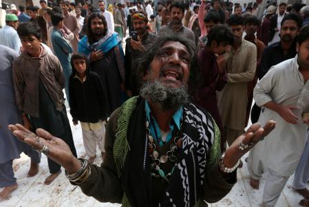 A man mourns the death of a relative who was killed in a suicide blast at the tomb of Sufi saint Syed Usman Marwandi, also known as the Lal Shahbaz Qalandar shrine, on Thursday evening in Sehwan Sharif, Pakistan's southern Sindh province, February 17, 2017. REUTERS/Akhtar Soomro