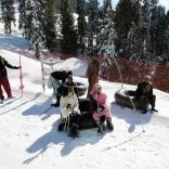 Customers and inner tube renters rest on the side of the piste at the ski resort in Malam Jabba, Pakistan February 7, 2017. REUTERS/Caren Firouz