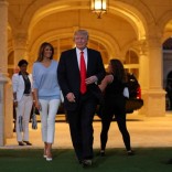 U.S. President Donald Trump and First Lady Melania Trump greet a marching band as they arrive at Trump International Golf club to watch the Super Bowl LI between New England Patriots and Atlanta Falcons in West Palm Beach, Florida, U.S.,  February 5, 2017. REUTERS/Carlos Barria