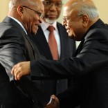 South Africa's new President Jacob Zuma (L) congratulates his new minister of Finance Pravin Gordhan as new Deputy President Kgalema Motlanthe (C) looks on in Pretoria on May 11, 2009. New South African President Jacob Zuma's cabinet appointments show a willingness to compromise to address the country's deep social and economic woes, local newspapers reported.    AFP PHOTO / ALEXANDER JOE / AFP PHOTO / ALEXANDER JOE