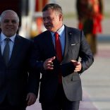 Jordan's King Abdullah II welcomes Iraqi Prime Minister Haider al-Abadi during a reception ceremony at the Queen Alia International Airport in Amman, Jordan March 28, 2017. REUTERS/Muhammad Hamed