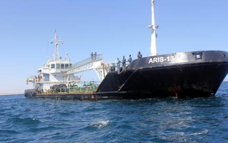 Maritime police are seen aboard oil tanker Aris-13, which was released by pirates, as it sails to dock on the shores of the Gulf of Aden in the city of Bosasso, northern Somalia's semi-autonomous region of Puntland, March 19, 2017. REUTERS/Abdiqani Hassan