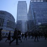 Workers walk to work during the morning rush hour in the financial district of Canary Wharf in London, Britain, January 26, 2017.  REUTERS/Eddie Keogh
