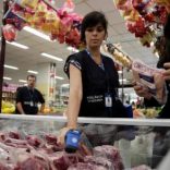 A member of the Public Health Surveillance Agency measures the temperature where the meats are exposed before collecting them to analyse in their laboratory, at a supermarket in Rio de Janeiro, Brazil, March 20, 2017. REUTERS/Ricardo Moraes