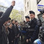 French police face off with members of the Chinese community during a protest demonstration outside a police station in Paris, France, March 28, 2017, after a Chinese man was shot dead by police at his Paris home on Sunday, triggering riots in the French capital by members of the Chinese community and a diplomatic protest by Beijing.    REUTERS/Noemie Olive