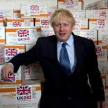 Britain's Foreign Secretary Boris Johnson pose for a photograph with food supplies before he helped to load the supplies for treating malnourished children affected by severe drought in Somalia onto a cargo plane at Mogadishu International Airport in Mogadishu, Somalia, March 15, 2017. REUTERS/Karel Prinsloo/UNICEF/Handout via