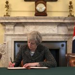British Prime Minister Theresa May in the cabinet office signs the official letter to European Council President Donald Tusk invoking Article 50 and the United Kingdom's intention to leave the EU on March 28, 2017 in London, England. After holding a referendum in June 2016 the United Kingdom voted to leave the European Union, the signing of Article 50 now officially triggers that process. REUTERS/Christopher Furlong/Pool