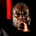 FILE PHOTO -  Zimbabwean President Robert Mugabe watches a video presentation during the summit of the Southern African Development Community (SADC) in Johannesburg, South Africa August 17, 2008. REUTERS/Mike Hutchings/File Photo       TPX IMAGES OF THE DAY