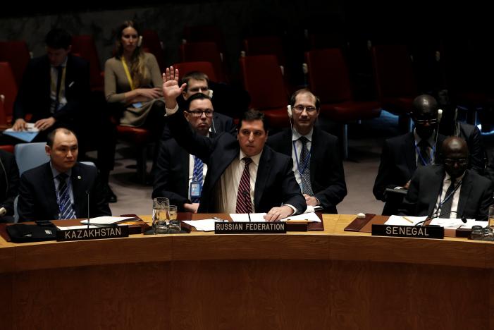 Russian Deputy Ambassador to the United Nations Vladimir Safronkov raises his arm to vote against a United Nations Security Council resolution to ban the supply of helicopters to the Syrian government and to blacklist Syrian military commanders over accusations of toxic gas attacks at U.N. headquarters in New York City, U.S., February 28, 2017. REUTERS/Mike Segar