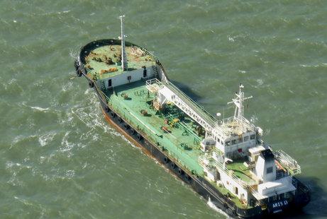 In this photo taken Monday, Oct. 27, 2014, the Aris 13 oil tanker is seen from a helicopter in the harbor of Gladstone, Australia. Pirates have hijacked the Aris 13 oil tanker off the coast of Somalia, officials and piracy experts said Tuesday, March 14, 2017, the first such seizure of a large commercial vessel on the crucial global trade route since 2012. (Kevin Finnigan/Tropic Maritime Images via AP)