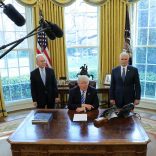 U.S. President Donald Trump talks to journalists at the Oval Office of the White House after the AHCA health care bill was pulled before a vote, accompanied by U.S. Health and Human Services Secretary Tom Price (L) and Vice President Mike Pence, in Washington, U.S. March 24, 2017. REUTERS/Carlos Barria