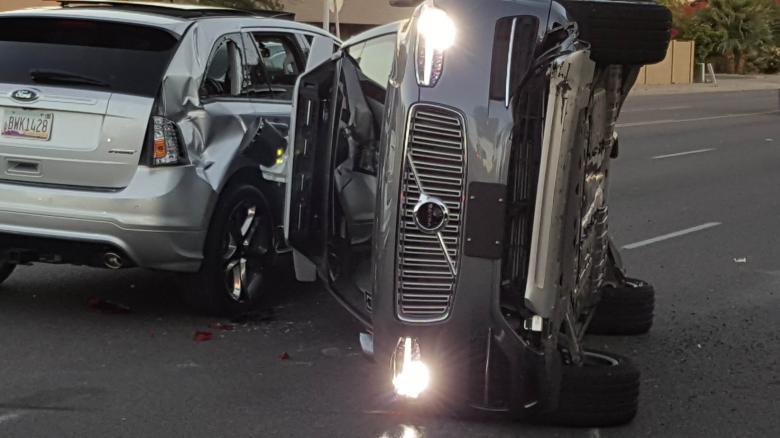 A self-driven Volvo SUV owned and operated by Uber Technologies Inc. is flipped on its side after a collision in Tempe, Arizona, U.S. on March 24, 2017. Courtesy FRESCO NEWS/Mark Beach/Handout via REUTERS