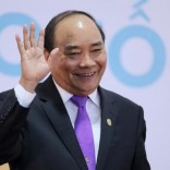 Vietnam's Prime Minister Nguyen Xuan Phuc waves as he leaves a news conference after the 8th Cambodia-Laos-Myanmar-Vietnam Summit (CLMV-8) and the 7th Ayeyawady-Chao Phraya-Mekong Economic Cooperation Strategy Summit (ACMECS-7) in Hanoi, Vietnam, October 26, 2016. REUTERS/Luong Thai Linh/Pool