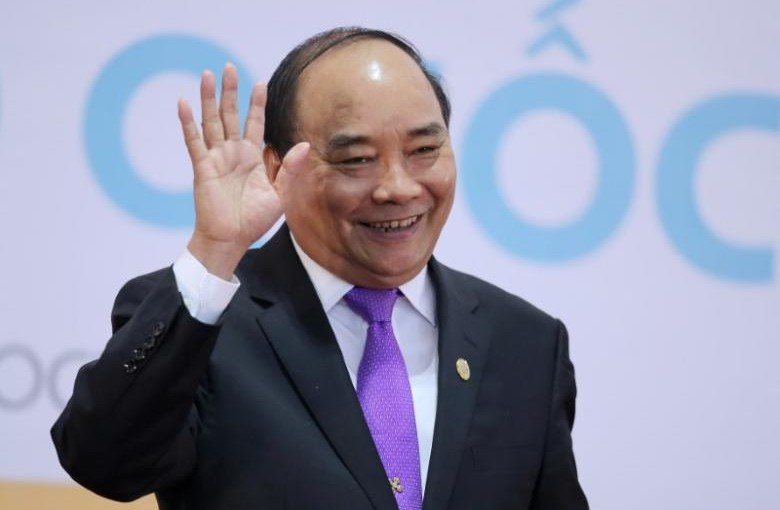 Vietnam's Prime Minister Nguyen Xuan Phuc waves as he leaves a news conference after the 8th Cambodia-Laos-Myanmar-Vietnam Summit (CLMV-8) and the 7th Ayeyawady-Chao Phraya-Mekong Economic Cooperation Strategy Summit (ACMECS-7) in Hanoi, Vietnam, October 26, 2016. REUTERS/Luong Thai Linh/Pool