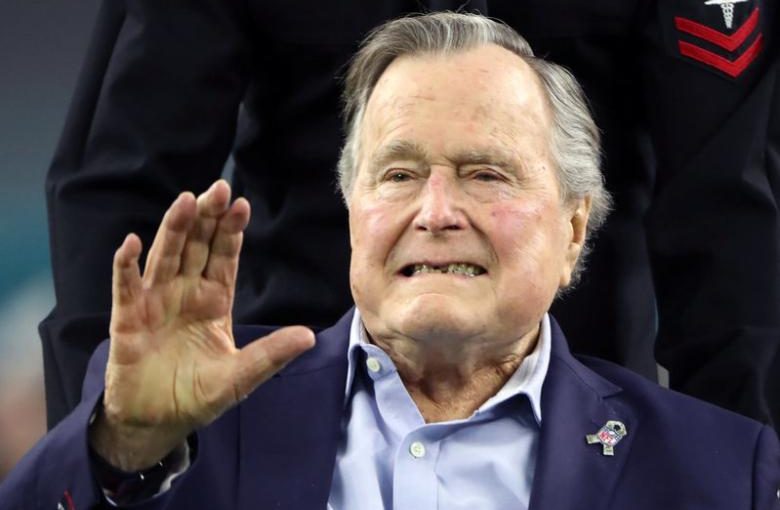 FILE PHOTO: Former U.S. President George H.W. Bush arrives on the field to do the coin toss ahead of the start of Super Bowl LI between the New England Patriots and the Atlanta Falcons in Houston, Texas, U.S. on February 5, 2017. REUTERS/Adrees Latif/File Photo