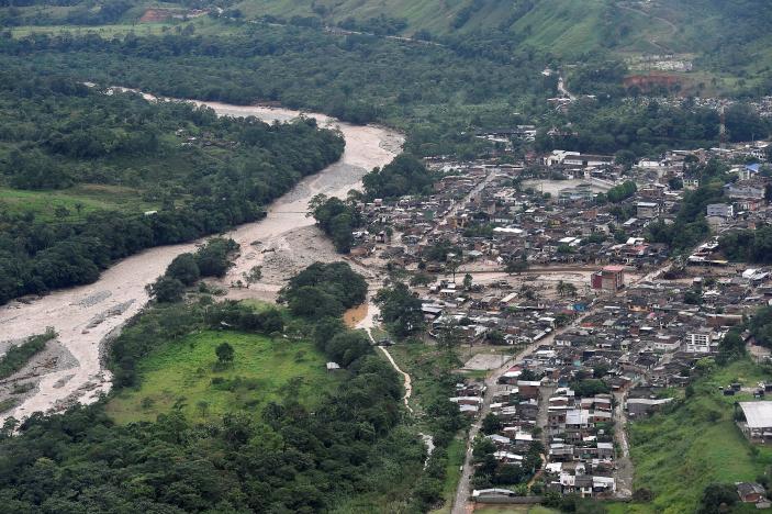 An aerial view shows a flooded area after heavy rains caused several rivers to overflow, pushing sediment and rocks into buildings and roads in Mocoa, Colombia April 1, 2017.  Cesar Carrion/Colombian Presidency/Handout via Reuters