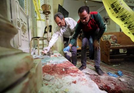 Forensics personnel inspect the site of an explosion that took place at a Coptic church on Sunday in Tanta, Egypt, April 9, 2017. REUTERS/Mohamed Abd El Ghany