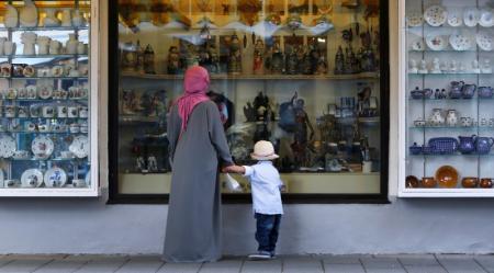 A woman wears a burka while visiting Garmisch-Partenkirchen, Germany August 16, 2016. REUTERS/Michaela Rehle