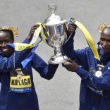 Boston Marathon women's division winner Edna Kiplagat, of Kenya, and men's division winner Geoffrey Kirui, also of Kenya, hold the trophy during the 121st Boston Marathon in Boston, Massachusetts, U.S., April 17, 2017.   REUTERS/Gretchen Ertl