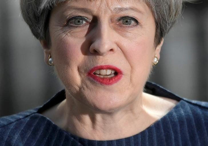 FILE PHOTO: Britain's Prime Minister Theresa May speaks to the media outside 10 Downing Street, in London, Britain April 18, 2017. REUTERS/Toby Melville/File Photo