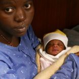 Mariam Ohene, a Nigerian migrant holds her baby girl aboard the former fishing trawler Golfo Azzurro, about thirty-two hours after her rescue along with other migrants from their drifting plastic rafts by Spanish NGO Proactiva Open Arms, in the Mediterranean Sea, off the Libyan coast April 2, 2017. REUTERS/Yannis Behrakis