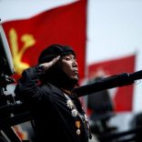 A soldier salutes from atop an armoured vehicle as it drives past the stand with North Korean leader Kim Jong Un during a military parade marking the 105th birth anniversary of country's founding father Kim Il Sung, in Pyongyang April 15, 2017. REUTERS/Damir Sagolj/Files