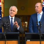Australia's Prime Minister Malcolm Turnbull speaks as Immigration Minister Peter Dutton listens on during a media conference at Parliament House in Canberra, Australia, April 18, 2017.    AAP/Lukas Coch/via REUTERS