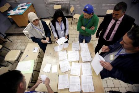 Election workers count ballots at the end of voting for the parliamentary election in Algiers, Algeria, May 4, 2017. REUTERS/Ramzi Boudina