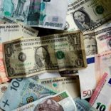 Bank notes of different currencies, including Euro, U.S. Dollar, Turkish Lira or Brazilian Reais, are photographed in Frankfurt, Germany, in this illustration picture taken May 7, 2017.  REUTERS/Kai Pfaffenbach/Illustration