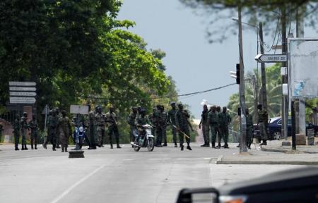 Mutinying soldiers stand next to their camp as they protest over a pay dispute in the centre of the commercial capital Abidjan, Ivory Coast, May 12, 2017. REUTERS/Luc Gnago