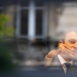 Emmanuel Macron, head of the political movement En Marche !, or Onwards !, and candidate for the 2017 presidential election, is pictured through a window of his hotel during a campaign visit in Rodez, France, May 5, 2017. REUTERS/Regis Duvignau